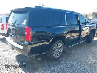 2019 Chevrolet Suburban LT with VIN 1GNSCJKC5KR360318, listed as a IAAI auction lot 41504344 with 82,997 mi miles and . Bid and sale history available at DreamBid. Image 4.