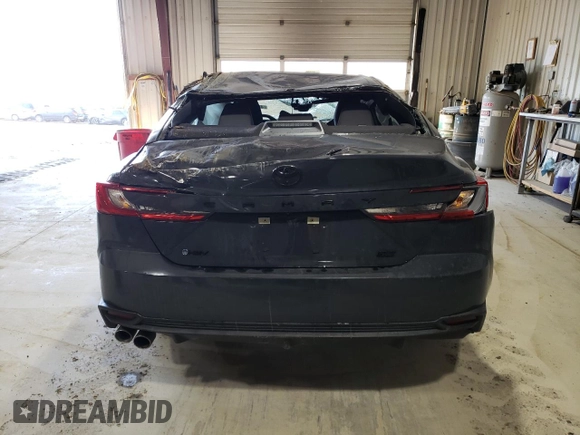2025 Toyota Camry LE with VIN 4T1DAACK9SU556042, listed as a Copart auction lot 46990605 with 10,468 mi miles and Salvage Title. Bid and sale history available at DreamBid. Image 6.
