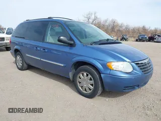 2007 Chrysler Town & Country Touring z VIN 2A4GP54L17R125711, wystawiony jako IAAI lot #41865946 z przebiegiem 169 558 mil mil oraz . Historia ofert i sprzedaży dostępna na DreamBid. Obrazek 1.
