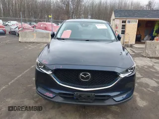 2021 Mazda CX-5 Touring with VIN JM3KFBCM7M1380396, listed as a IAAI auction lot 41707612 with 55,555 mi miles. Bid and sale history available at carsss.com. Image 6.
