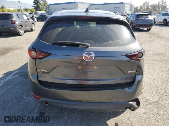 2020 Mazda CX-5 Touring with VIN JM3KFACM9L0815692, listed as a Copart auction lot 52431295 with 59,359 mi miles and Salvage Title. Bid and sale history available at DreamBid. Image 6.