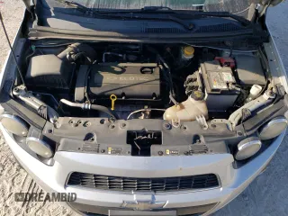 2012 Chevrolet Sonic LTZ z VIN 1G1JE6SH4C4101608, wystawiony jako Copart lot #53111725 z przebiegiem 203 012 mil mil oraz Szkoda całkowita • Salvage title. Historia ofert i sprzedaży dostępna na DreamBid. Obrazek 11.