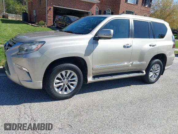 2014 Lexus GX with VIN JTJBM7FX7E5068037, listed as a IAAI auction lot 42069809 with 120,791 mi miles. Bid and sale history available at carsss.com. Image 2.