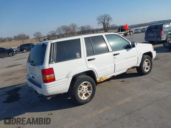 1997 Jeep Grand Cherokee Limited with VIN 1J4GZ78Y8VC769675, listed as a IAAI auction lot 41694347 with 113,834 mi miles. Bid and sale history available at carsss.com. Image 4.