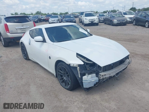 2012 Nissan 370Z z VIN JN1AZ4EH5CM564517, wystawiony jako IAAI lot #42385869 z przebiegiem 55 359 mil mil oraz . Historia ofert i sprzedaży dostępna na DreamBid. Obrazek 1.