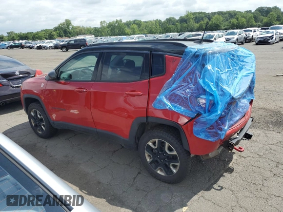 2017 Jeep Compass Trailhawk with VIN 3C4NJDDB7HT657463, listed as a Copart auction lot 60650765 with 100,979 mi miles and Salvage title. Bid and sale history available at DreamBid. Image 2.