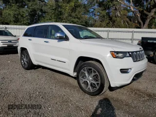 2019 Jeep Grand Cherokee Overland with VIN 1C4RJFCT2KC834690, listed as a Copart auction lot 84303144 with 63,053 mi miles and Salvage Title. Bid and sale history available at carsss.com. Image 4.
