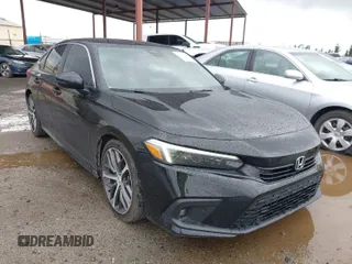 2022 Honda Civic Sedan Touring with VIN 2HGFE1F93NH302409, listed as a IAAI auction lot 41719494 with 34,129 mi miles. Bid and sale history available at carsss.com. Image 1.