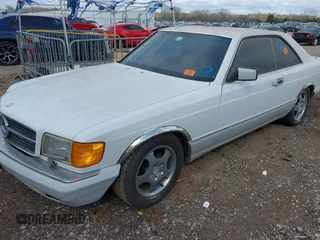 1990 Mercedes-Benz 560 with VIN WDBCA45E9LA549067, listed as a IAAI auction lot 41849642 with 124,516 mi miles and . Bid and sale history available at DreamBid. Image 2.