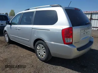 2012 Kia Sedona LX with VIN KNDMG4C70C6491703, listed as a IAAI auction lot 42128411 with 246,586 mi miles. Bid and sale history available at carsss.com. Image 3.