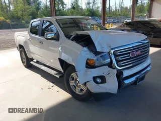 2015 GMC Canyon 2WD SLE with VIN 1GTG5CEA1F1273955, listed as a IAAI auction lot 42392908 with 79,981 mi miles and . Bid and sale history available at DreamBid. Image 1.