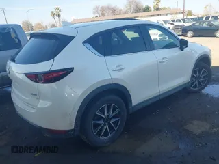 2017 Mazda CX-5 Grand Touring with VIN JM3KFBDL6H0164993, listed as a IAAI auction lot 41450556 with 97,733 mi miles. Bid and sale history available at carsss.com. Image 4.