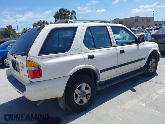 1999 Isuzu Rodeo S z VIN 4S2CM58WXX4347611, wystawiony jako IAAI lot #42351641 z przebiegiem 256 007 mil mil oraz . Historia ofert i sprzedaży dostępna na DreamBid. Obrazek 4.