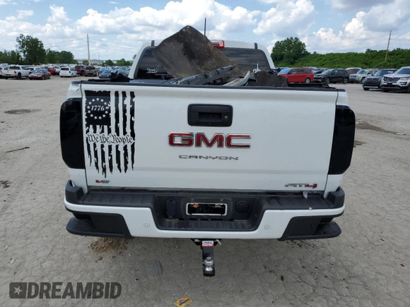 2021 GMC Canyon 4WD AT4 z VIN 1GTG6FEN9M1147406, wystawiony jako Copart lot #55454634 z przebiegiem 82 898 mil mil oraz Szkody całkowita. Historia ofert i sprzedaży dostępna na DreamBid. Obrazek 6.