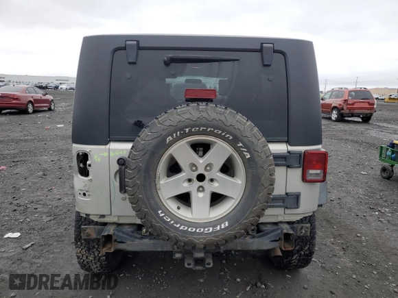 2007 Jeep Wrangler Unlimited Rubicon с VIN 1J8GA691X7L191115, выставлен на аукционе Copart как лот 87523925 с пробегом 85 709 миль миль и Списание • Salvage title. История ставок и продаж доступна на DreamBid. Изображение 6.