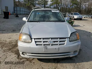2003 Hyundai Accent GL with VIN KMHCG35CX3U270374, listed as a Copart auction lot 47240325 with 122,739 mi miles and Salvage Title. Bid and sale history available at carsss.com. Image 5.