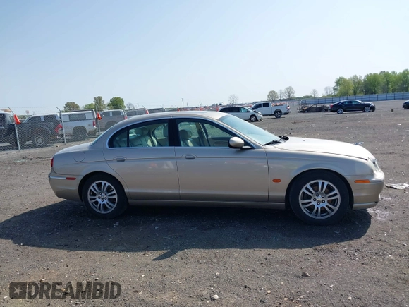 2005 Jaguar S-Type with VIN SAJWA01T95FN22745, listed as a IAAI auction lot 41898269 with 57,614 mi miles and . Bid and sale history available at DreamBid. Image 13.