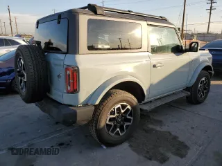 2021 Ford Bronco z VIN 1FMDE5AP0MLA98152, wystawiony jako Copart lot #84872094 z przebiegiem 10 907 mil mil oraz Szkoda całkowita • Salvage title. Historia ofert i sprzedaży dostępna na DreamBid. Obrazek 3.