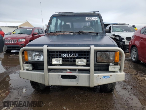 1991 Isuzu Trooper z VIN JACCH58E3M7900325, wystawiony jako Copart lot #79525294 z przebiegiem 146 593 mil mil oraz Czysty tytuł • Clean title. Historia ofert i sprzedaży dostępna na DreamBid. Obrazek 5.