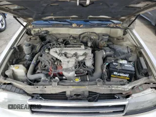 1990 Nissan Maxima z VIN JN1HJ01P8LT402950, wystawiony jako Copart lot #82714734 z przebiegiem 60 727 mil mil oraz Tytuł czysty. Historia ofert i sprzedaży dostępna na DreamBid. Obrazek 11.