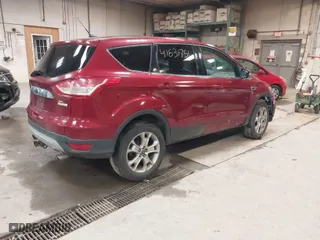 2013 Ford Escape SEL with VIN 1FMCU9H97DUB34880, listed as a IAAI auction lot 41531751 with 152,966 mi miles. Bid and sale history available at carsss.com. Image 4.
