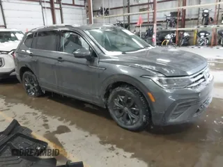 2023 Volkswagen Tiguan SE with VIN 3VVMB7AX5PM013447, listed as a IAAI auction lot 41615200 with 66,259 mi miles and . Bid and sale history available at DreamBid. Image 1.