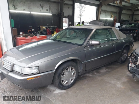1999 Cadillac Eldorado ESC z VIN 1G6EL12Y8XU612393, wystawiony jako IAAI lot #41761839 z przebiegiem 104 994 mil mil oraz . Historia ofert i sprzedaży dostępna na DreamBid. Obrazek 2.