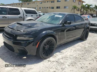 2021 Dodge Charger SRT Hellcat Widebody z VIN 2C3CDXL93MH660916, wystawiony jako Copart lot #51233805 z przebiegiem 27 729 mil mil oraz Czysty tytuł • Clean title. Historia ofert i sprzedaży dostępna na DreamBid. Obrazek 1.