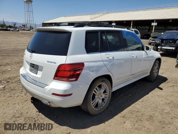 2015 Mercedes-Benz GLK 250 with VIN WDCGG0EB2FG402004, listed as a Copart auction lot 63126493 with 130,821 mi miles and . Bid and sale history available at DreamBid. Image 3.