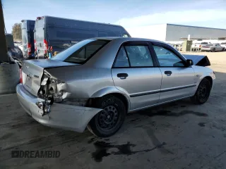 2002 Mazda Protege DX with VIN JM1BJ225120605237, listed as a Copart auction lot 49331225 with 184,556 mi miles and Salvage Title. Bid and sale history available at DreamBid. Image 3.