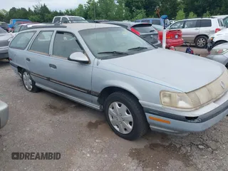 1990 Mercury Sable with VIN 1MECM55U5LA600326, listed as a IAAI auction lot 42629859 with 64,312 mi miles and . Bid and sale history available at DreamBid. Image 1.