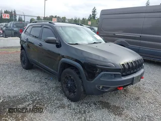 2014 Jeep Cherokee Trailhawk z VIN 1C4PJMBB1EW145683, wystawiony jako IAAI lot #42487730 z przebiegiem 148 277 mil mil oraz . Historia ofert i sprzedaży dostępna na DreamBid. Obrazek 1.