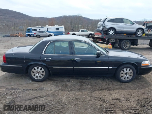 2005 Mercury Grand Marquis LS Premium z VIN 2MEFM75W65X671622, wystawiony jako IAAI lot #41958287 z przebiegiem 154 662 mil mil oraz . Historia ofert i sprzedaży dostępna na DreamBid. Obrazek 13.