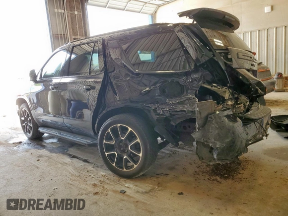 2023 Chevrolet Tahoe RST with VIN 1GNSCRKD5PR290351, listed as a Copart auction lot 58806595 with 64,909 mi miles and Salvage title. Bid and sale history available at DreamBid. Image 2.