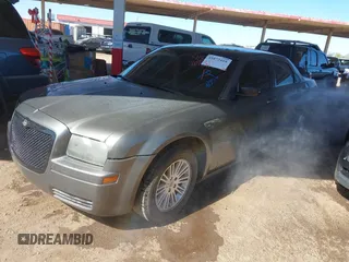 2009 Chrysler 300 LX with VIN 2C3KA43D79H574863, listed as a IAAI auction lot 41872418 with 1 mi miles. Bid and sale history available at carsss.com. Image 2.