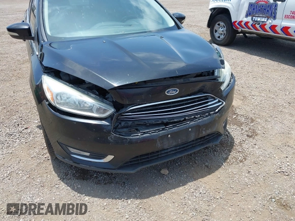 2016 Ford Focus Titanium z VIN 1FADP3J20GL310467, wystawiony jako IAAI lot #42478332 z przebiegiem 214 479 mil mil oraz . Historia ofert i sprzedaży dostępna na DreamBid. Obrazek 6.
