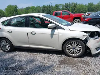 2016 Ford Focus Titanium with VIN 1FADP3N26GL332709, listed as a IAAI auction lot 42458997 with 75,509 mi miles and . Bid and sale history available at DreamBid. Image 13.