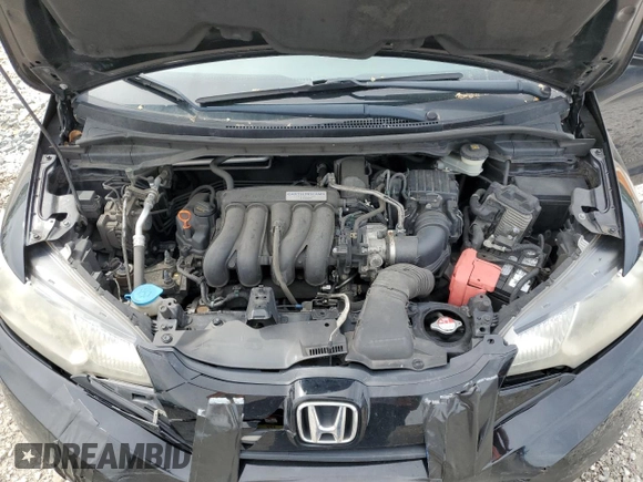 2017 Honda Fit LX z VIN JHMGK5H57HS017091, wystawiony jako Copart lot #55540555 z przebiegiem 98 170 mil mil oraz Szkoda całkowita • Salvage title. Historia ofert i sprzedaży dostępna na DreamBid. Obrazek 11.