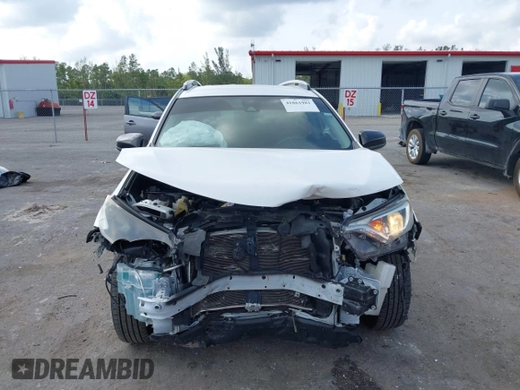 2017 Toyota RAV4 LE with VIN JTMZFREV3HJ143416, listed as a IAAI auction lot 41861981 with 115,241 mi miles and . Bid and sale history available at DreamBid. Image 6.