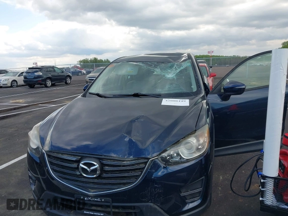 2016 Mazda CX-5 Sport with VIN JM3KE2BY3G0740488, listed as a IAAI auction lot 42000449 with 43,009 mi miles. Bid and sale history available at carsss.com. Image 6.