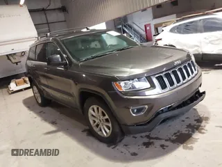 2014 Jeep Grand Cherokee Laredo with VIN 1C4RJEAG7EC145023, listed as a IAAI auction lot 40518825 with 115,098 mi miles and . Bid and sale history available at DreamBid. Image 1.