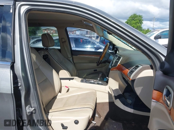 2011 Jeep Grand Cherokee Overland Summit with VIN 1J4RR6GT3BC713812, listed as a IAAI auction lot 42398585 with 208,476 mi miles and . Bid and sale history available at DreamBid. Image 5.