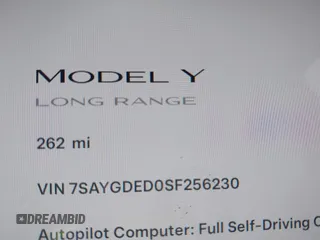 2025 Tesla Model Y Long Range with VIN 7SAYGDED0SF256230, listed as a IAAI auction lot 41356520 with 262 mi miles and . Bid and sale history available at DreamBid. Image 15.