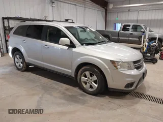 2012 Dodge Journey SXT z VIN 3C4PDDBGXCT257498, wystawiony jako IAAI lot #41746098 z przebiegiem 197 796 mil mil oraz . Historia ofert i sprzedaży dostępna na DreamBid. Obrazek 1.