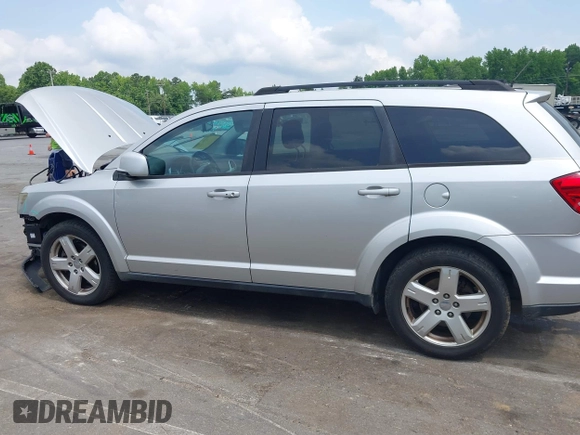 2012 Dodge Journey SXT z VIN 3C4PDCBGXCT324756, wystawiony jako IAAI lot #42422533 z przebiegiem 241 934 mil mil oraz . Historia ofert i sprzedaży dostępna na DreamBid. Obrazek 14.