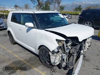 2014 Scion xB with VIN JTLZE4FE5EJ065953, listed as a IAAI auction lot 41850554 with 124,856 mi miles. Bid and sale history available at carsss.com. Image 1.