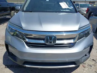 2019 Honda Pilot EX-L with VIN 5FNYF5H58KB040331, listed as a IAAI auction lot 41977727 with 90,655 mi miles and . Bid and sale history available at DreamBid. Image 12.
