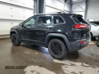 2014 Jeep Cherokee Trailhawk with VIN 1C4PJMBS5EW294212, listed as a Copart auction lot 88816885 with 151,779 mi miles and Salvage title. Bid and sale history available at DreamBid. Image 2.