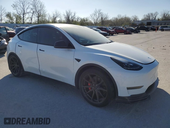 2021 Tesla Model Y Performance with VIN 5YJYGDEF3MF262878, listed as a Copart auction lot 52897595 with 50,939 mi miles and Salvage Title. Bid and sale history available at DreamBid. Image 4.
