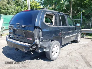 2005 GMC Envoy SLE with VIN 1GKDS13S452208252, listed as a IAAI auction lot 42357457 with 197,419 mi miles and . Bid and sale history available at DreamBid. Image 4.
